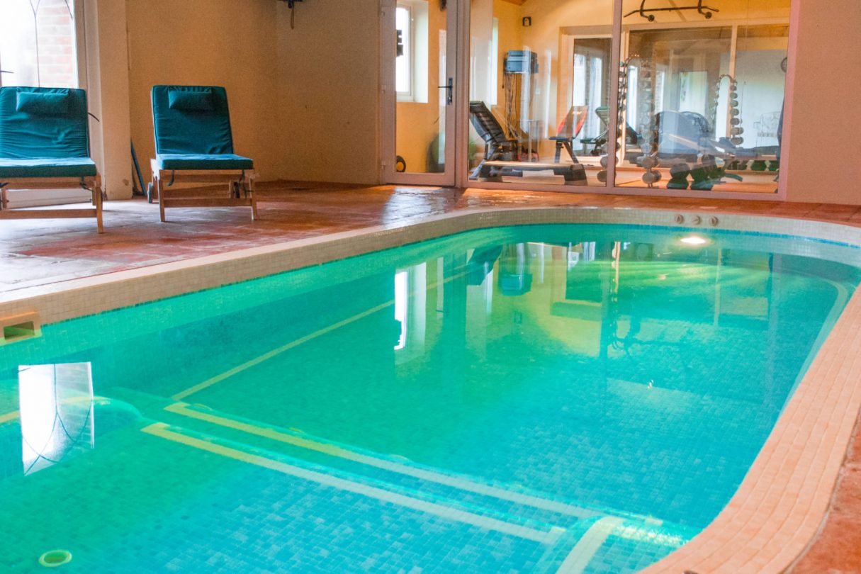 photo showing indoor pool attached to luxury property manor lodge