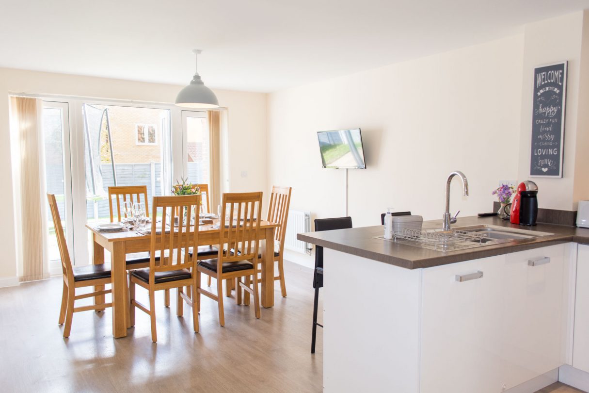 Kitchen/dining photo including a shot of the patio doors which lead out to the garden.