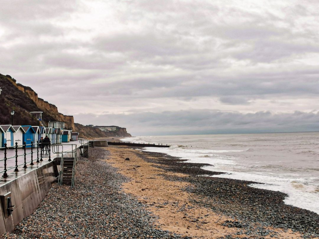 Photo of Cromer beach and cliff tops.