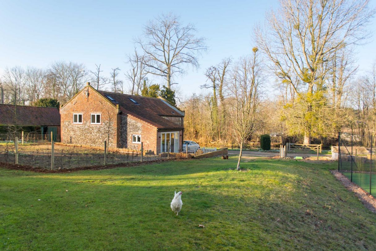 Boathouse Barn with a chicken roaming the gardens