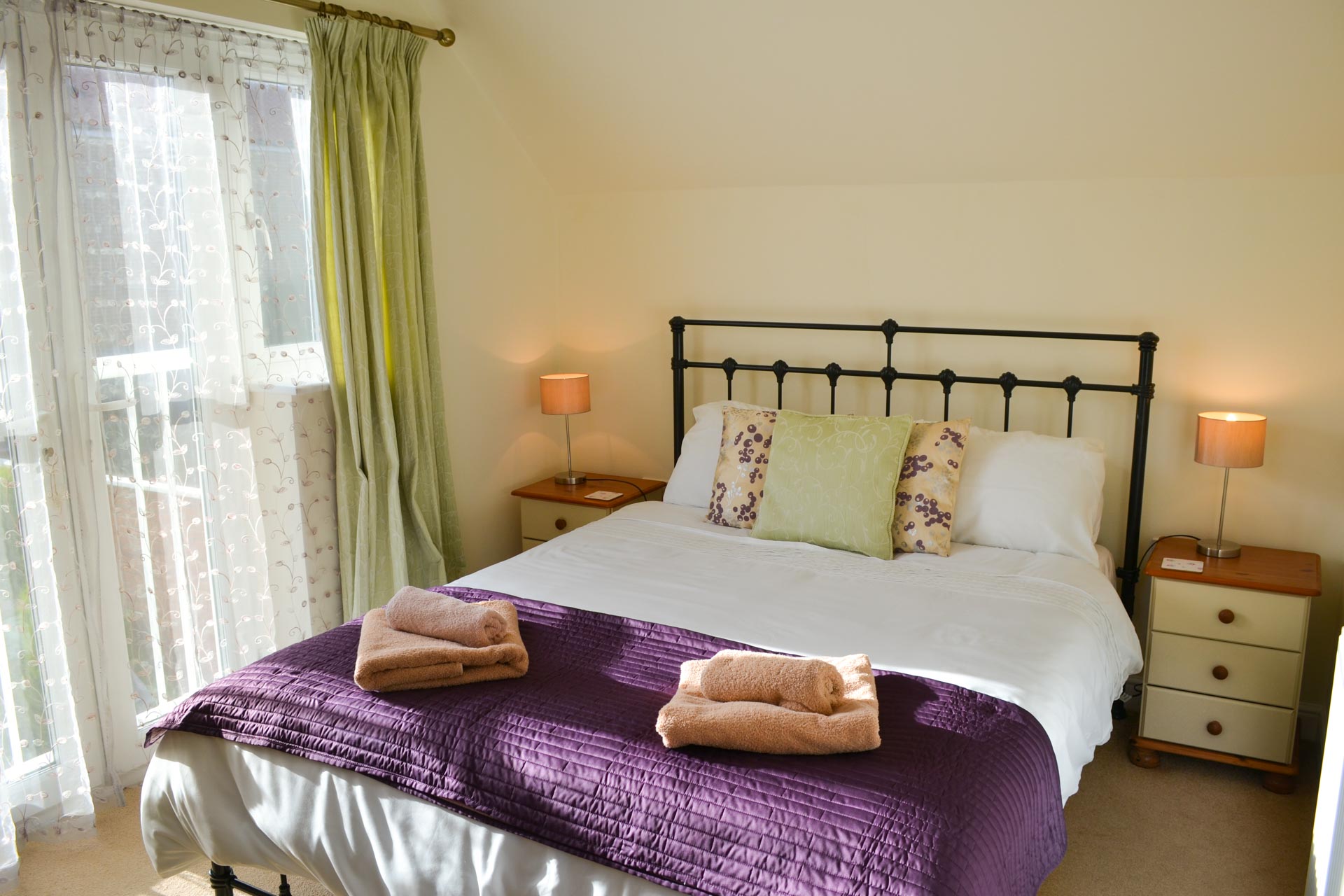 Old Dairy Court master bedroom with king-size bed.