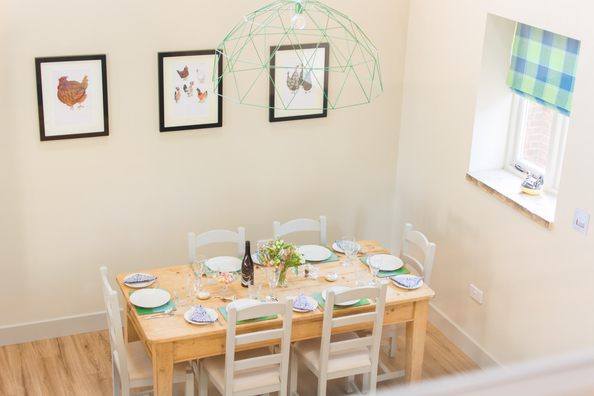 Dining area showing a laid table. Taken from the twin room upstairs bedroom.