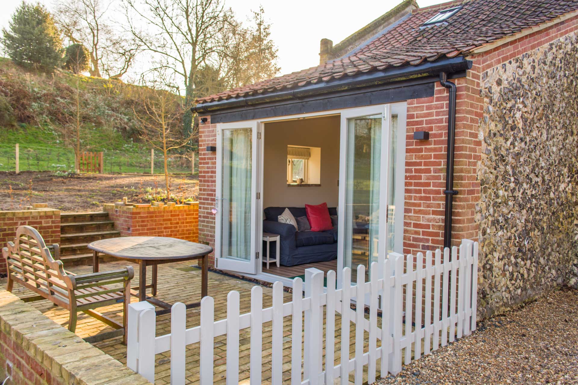 Fenced patio area and table.