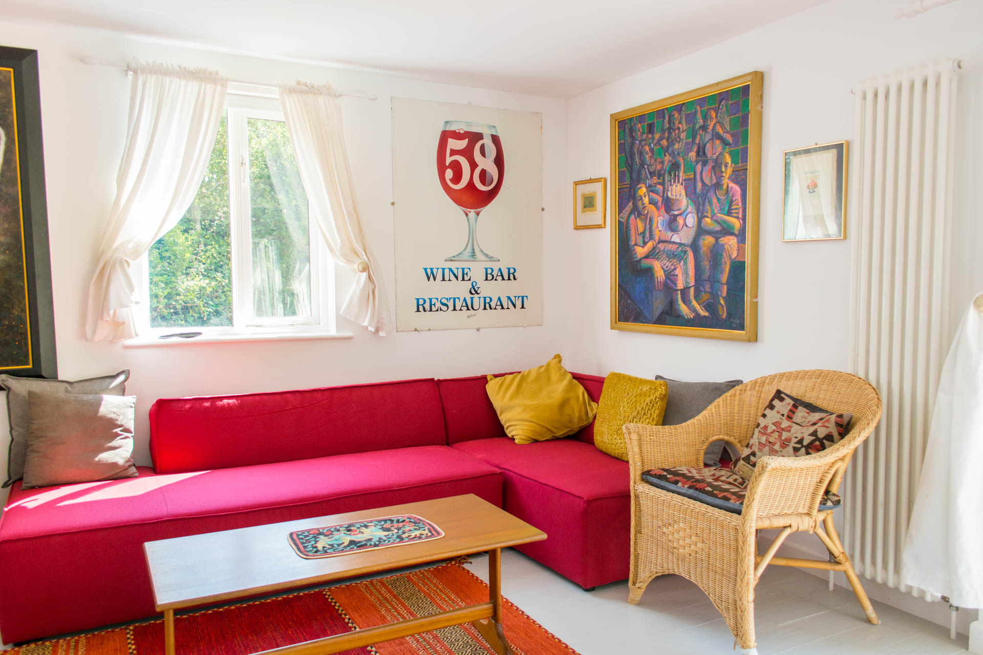 Image showing second family living area with red couch and artwork.