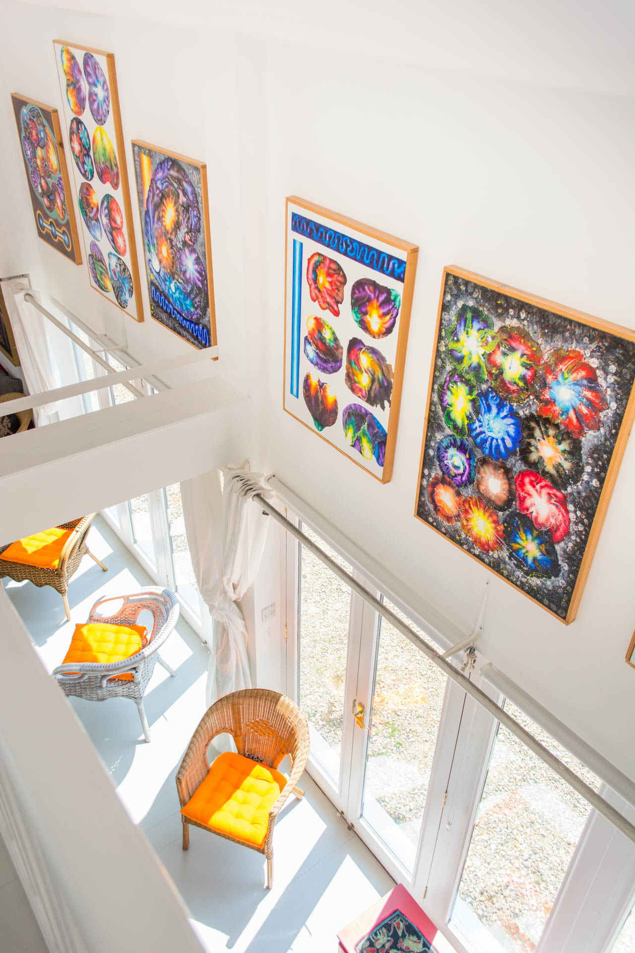 Colourful artwork on the walls placed between the ground and mezzanine floor.