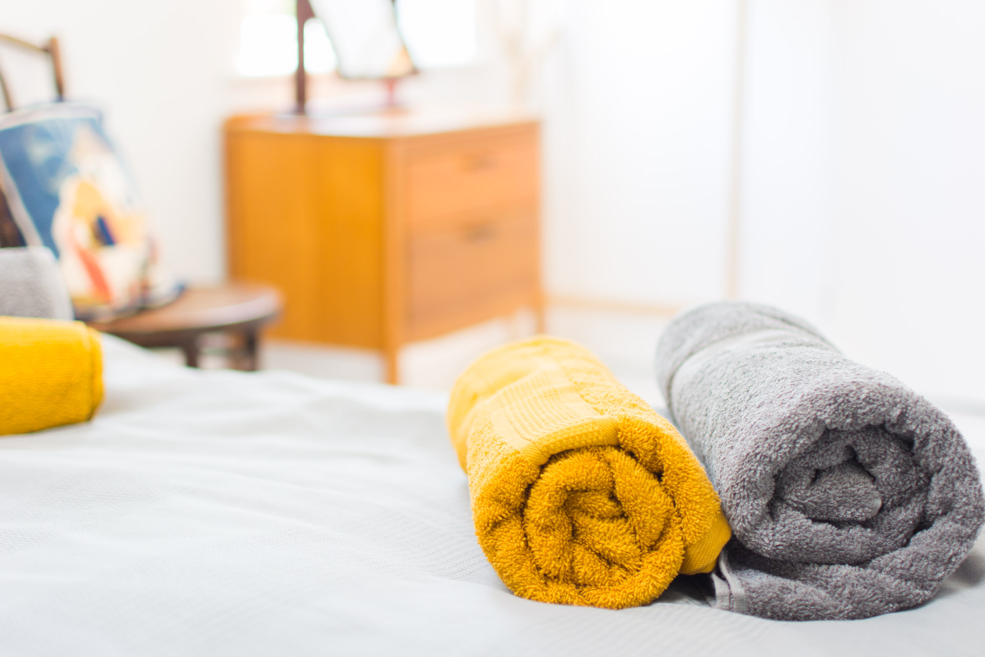 Close up photo of towels in the bed.