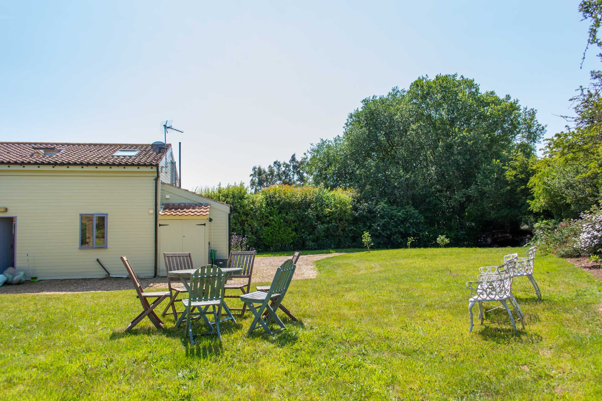 Outside dining area with Hen Barn in the background.